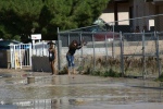 Bad parents lets their kids play in flooded areas.